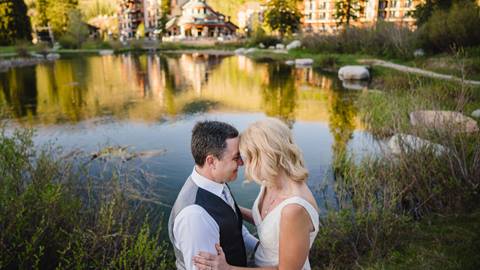 Bride and Groom at Solitude Pond with Solitude Village in Background