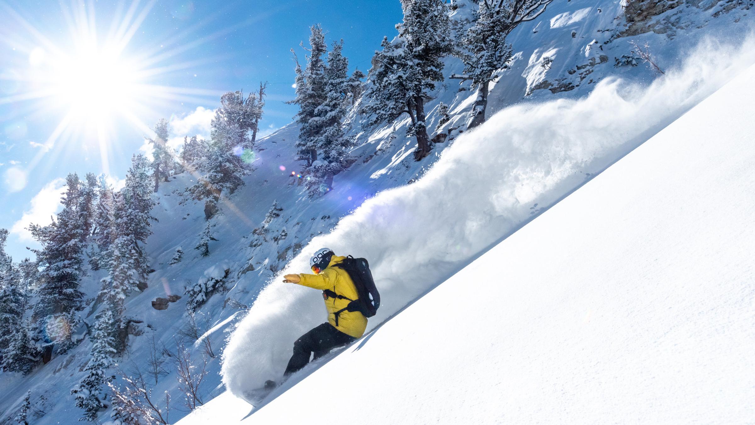 Snowboarder on a blue powder day