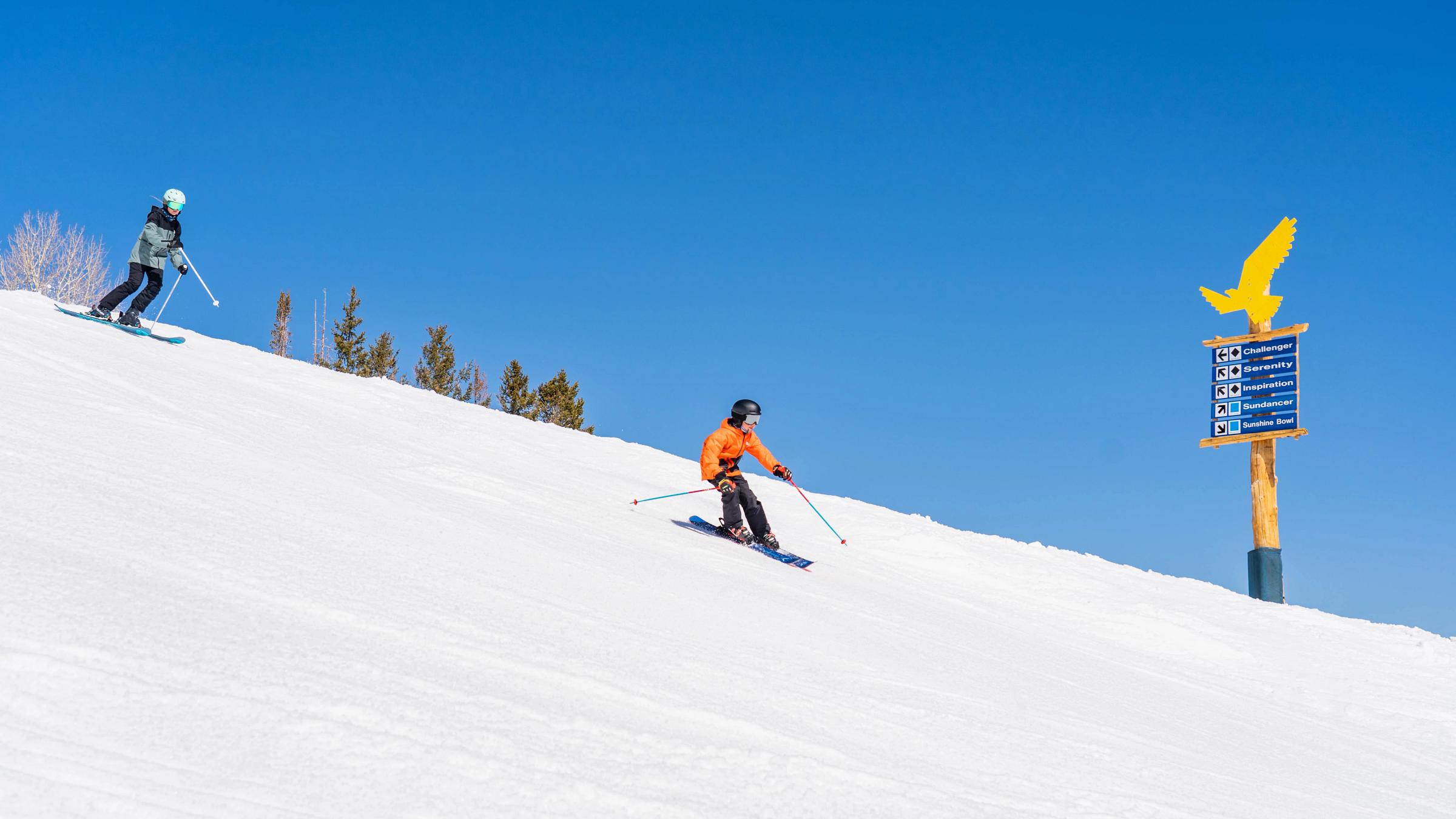 A family skiing together at Solitude Mountain Resort