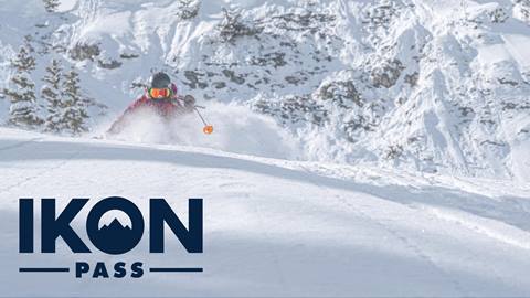 Skier in deep powder with Ikon Pass